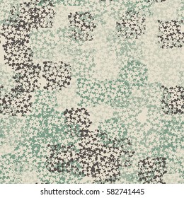 Seamless pattern. Clouts with stars. Random order. Spotted chaos. Fashion camouflage. Grunge image.