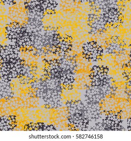 Seamless pattern. Clouts with stars. Random order. Spotted chaos. Fashion camouflage. Grunge image.