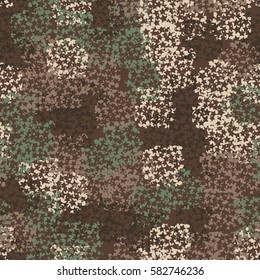 Seamless pattern. Clouts with stars. Random order. Spotted chaos. Fashion camouflage. Grunge image.