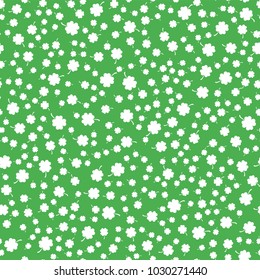 Seamless pattern from the clover leaves. Background to the day of St. Patrick. Vector illustration.
