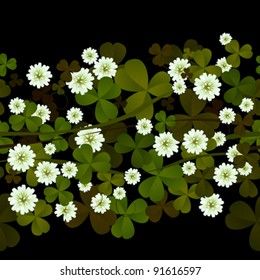 Seamless pattern with clover leaves and flowers over black