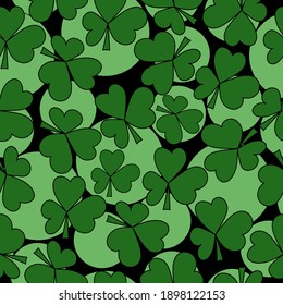 Seamless pattern of clover leaves and light green circles of various sizes on a black background, a symbol of good luck and St. Patrick's day illustration