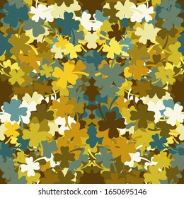 Seamless pattern of clover leaves on a brown background. Vector image. eps 10