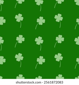 Seamless pattern with clover leaves on a green background