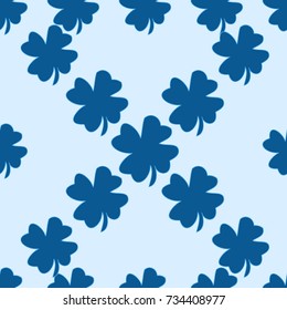 Seamless pattern. Clover leaves on a blue background