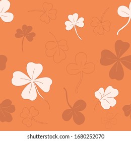 Seamless pattern with clover. clover leaves. Orange pattern. Lots of clover leaves Vector illustration. Stock vector.