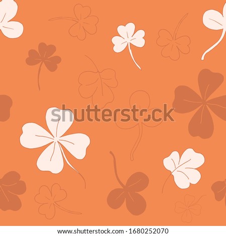Seamless pattern with clover. clover leaves. Orange pattern. Lots of clover leaves Vector illustration. Stock vector.