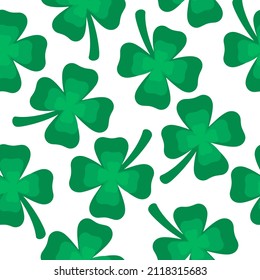 Seamless pattern with clover leaves. Pattern for Saint Patrick's Day. Four leaf clover isolated on white background. Chaotic shamrocks pattern. Hand-drawn in cartoon style. 