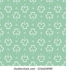 Seamless pattern with clover leaves. Shamrock background. St. Patrick's Day. Design for banner and print.