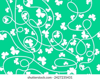 Seamless pattern of clover leaves for St. Patrick's Day. White silhouettes of clovers on a green background. Irish holiday design for wallpaper, banners and promotional materials. Vector illustration