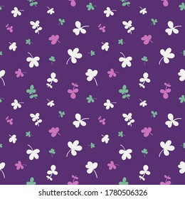 Seamless pattern with clover leaves.Magical plant. Background for St. Patrick's Day. Violet endless backdrop with trefoils and quatrefoils. Shamrock. Irish story. Vector illustration.