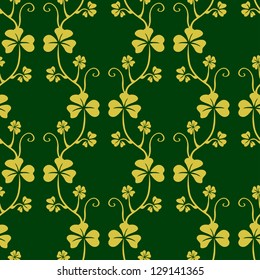 Seamless pattern with clover on dark green background