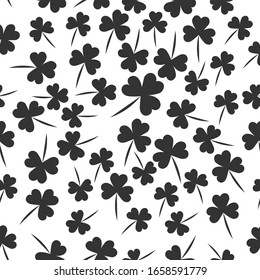 Seamless pattern with  clover  the symbol of St. Patrick's day. Vector  illustration with shamrock symbol of Ireland, hand drawn in doodle  on white background for design, kids decor, wrapping