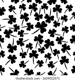 Seamless pattern with  clover  the symbol of St. Patrick's day. Vector  illustration with shamrock symbol of Ireland, hand drawn in doodle  on white background for design, kids decor, wrapping