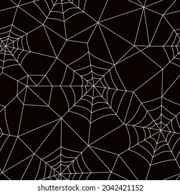 seamless pattern of cobwebs on black background. vector