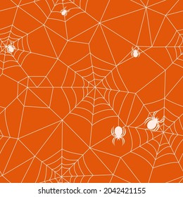 seamless pattern of cobwebs on orange background. vector