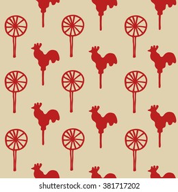 Seamless pattern cock lollipop vector red sweetmeats on a yellow  gold background