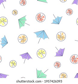 Seamless pattern with cocktail umbrellas, lemons, oranges and grapefruits