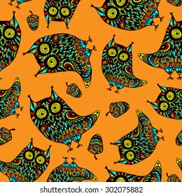 seamless pattern with color owls and acorns on the orange background