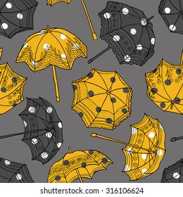 Seamless pattern with color yellow and black umbrellas on a gray background. Vector illustration.