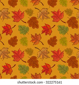 Seamless pattern with colored autumn leaves, in bright colors. On orange background