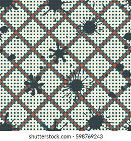 Seamless pattern. Colored blots on a plaid background. Grungy textiles. Wallpaper for children. Flat. Cartoon.