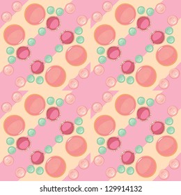 Seamless pattern of colored buttons on striped background