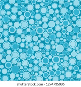 Seamless pattern. Colored circles scattered on a blue background. For graphic design.