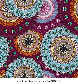 Seamless pattern with colored circular floral ornament. Floral background with mandalas for the greeting cards, invitation, business style, cards, textile backgrounds or else. Vector illustration.