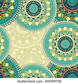 Seamless pattern with colored circular floral ornament. Background with mandalas for the greeting cards, invitation, business style, cards, textile backgrounds or else. Vector illustration.