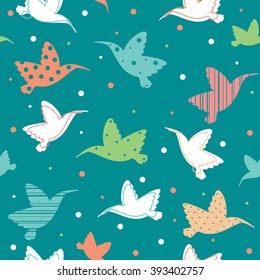 Seamless pattern with colored colibri. Vector wallpaper with cartoon hummingbirds.