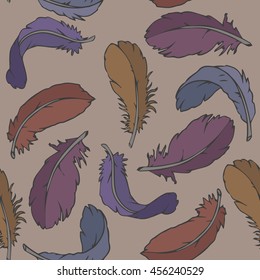 Seamless pattern with colored feathers on light brown background