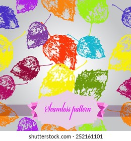 Seamless pattern of colored floral motif, autumn leaves, label on a gradient gray   background. Hand drawn.