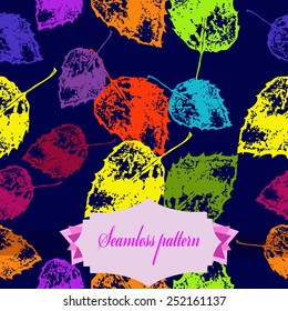 Seamless pattern of colored floral motif, autumn leaves, label on a  dark blue  background. Hand drawn.