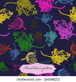 Seamless pattern of colored floral motif, maple leaves. Hand drawn.