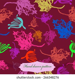 Seamless pattern of colored floral motif, maple leaves. Hand drawn.