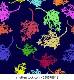 Seamless pattern of colored floral motif,maple leaves on a dark blue   background. Hand drawn. Autumn theme.