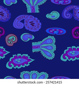 Seamless pattern of colored floral motifs on a dark blue    background. Hand drawn.