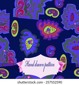 Seamless pattern of colored floral motifs, label on a dark blue   background. Hand drawn. 