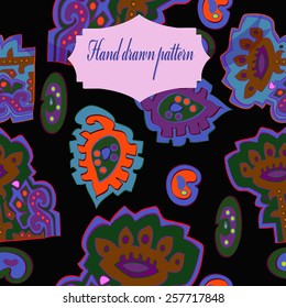 Seamless pattern of colored floral motifs, label on a  black  background. Hand drawn. 