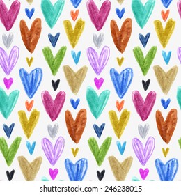Seamless pattern with colored hand drawn hearts. White backdrop. Valentines day background. Used as greeting card or wedding invitation for your design.