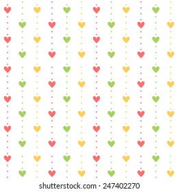 Seamless pattern.  Colored heart and dots (yellow, pink and green) on white background