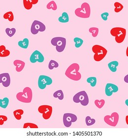 Seamless pattern with colored hearts with letters L, O, V, E. Romantic print. Cute vector illustration.