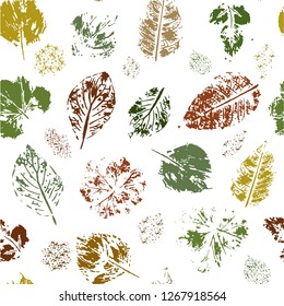 Seamless pattern of colored leaves stamps on a white background. Vector.