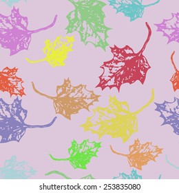 Seamless pattern of colored maple leaves  on a pale pink   background. Hand drawn. Autumn theme.