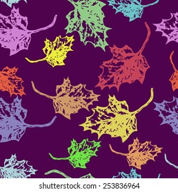 Seamless pattern of colored maple leaves  on a  dark pink   background. Hand drawn. Autumn theme.