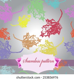 Seamless pattern of colored maple leaves, label  on a  gradient gray   background. Hand drawn. Autumn theme.