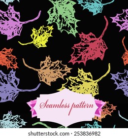 Seamless pattern of colored maple leaves, label  on a black    background. Hand drawn. Autumn theme.