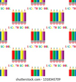 Seamless pattern of colored pencils on white background. Back to school inscription.