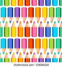 Seamless pattern of colored pencils on white background